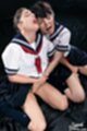 Kogals kneeling together in uniform faces glazed with bukkake cum hands under their skirts